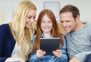 family-with-ipad-happy
