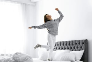 winter-jumping-on-a-bed-happy-and-safe